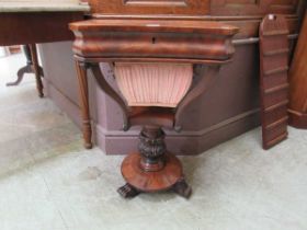A Victorian flame mahogany trumpet work table