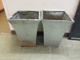 A pair of galvanised garden planters