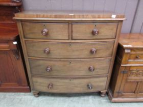 A Victorian mahogany bow fronted chest of two short over three long graduating drawers Dimensions: