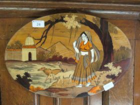 An eastern carved oval inlaid plaque of young ladies with sheep