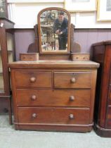 A late Victorian mahogany veneered chest of two short over three long drawers with swing mirror