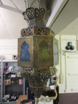 A gilt metal ceiling hanging light shade