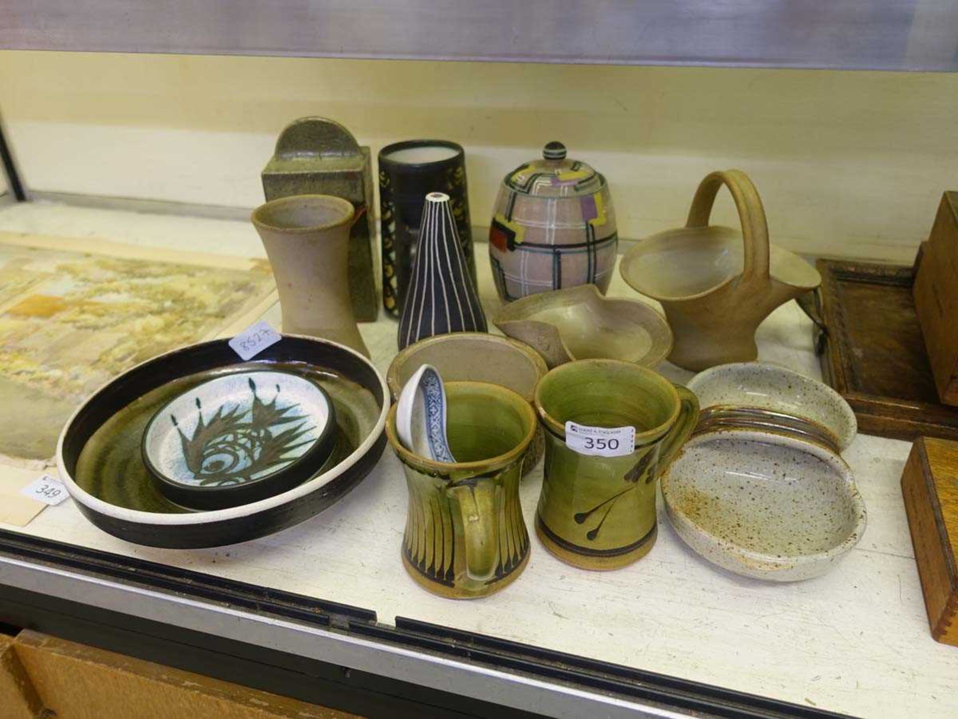 A selection of glazed stoneware items to include basket, mugs, bowls, etc
