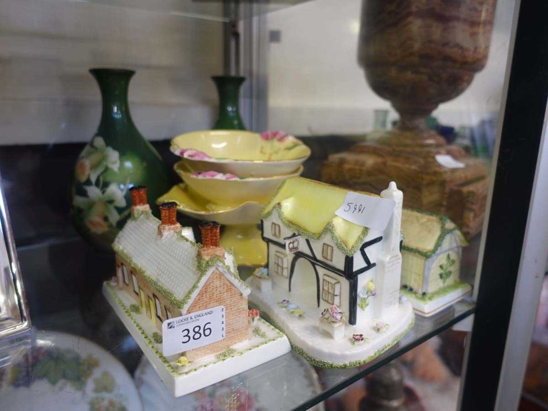 A selection of various ceramic ware to include yellow Royal Winton items, three ceramic cottages