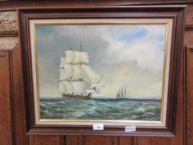 A framed oil on board of ships signed bottom right F.Ward