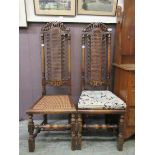A pair of early 20th century reproduction oak high back chairs with bergere backs