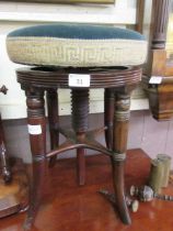 A Victorian mahogany circular seated adjustable music stool