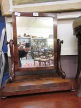 A Victorian flame mahogany swing toilet mirror