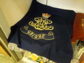 An embroidery with Royal style insignia along with one other embroidery