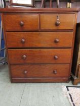 A late Victorian mahogany chest of two short over three long drawers