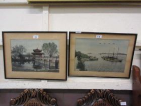 A pair of framed and glazed oriental embroideries, one of boats, the other of building