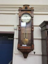 A late Victorian mahogany veneered Vienna wall clock