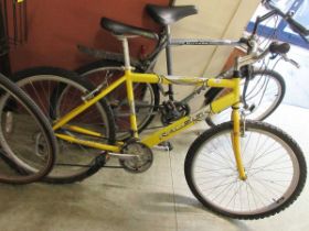 A yellow Raleigh mountain bike