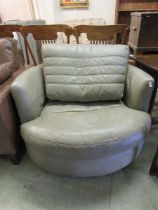 A modern grey leather swivel chair