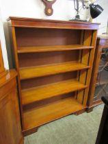 A reproduction yew bookcase