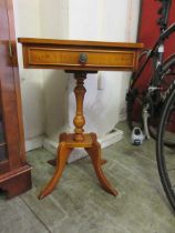 A yew occasional table single drawer
