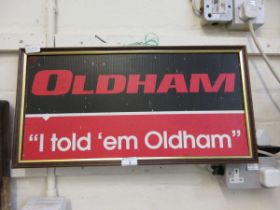 A framed advertising plaque for Oldhams