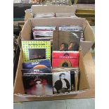 Three boxes of 45 rpm pop singles records