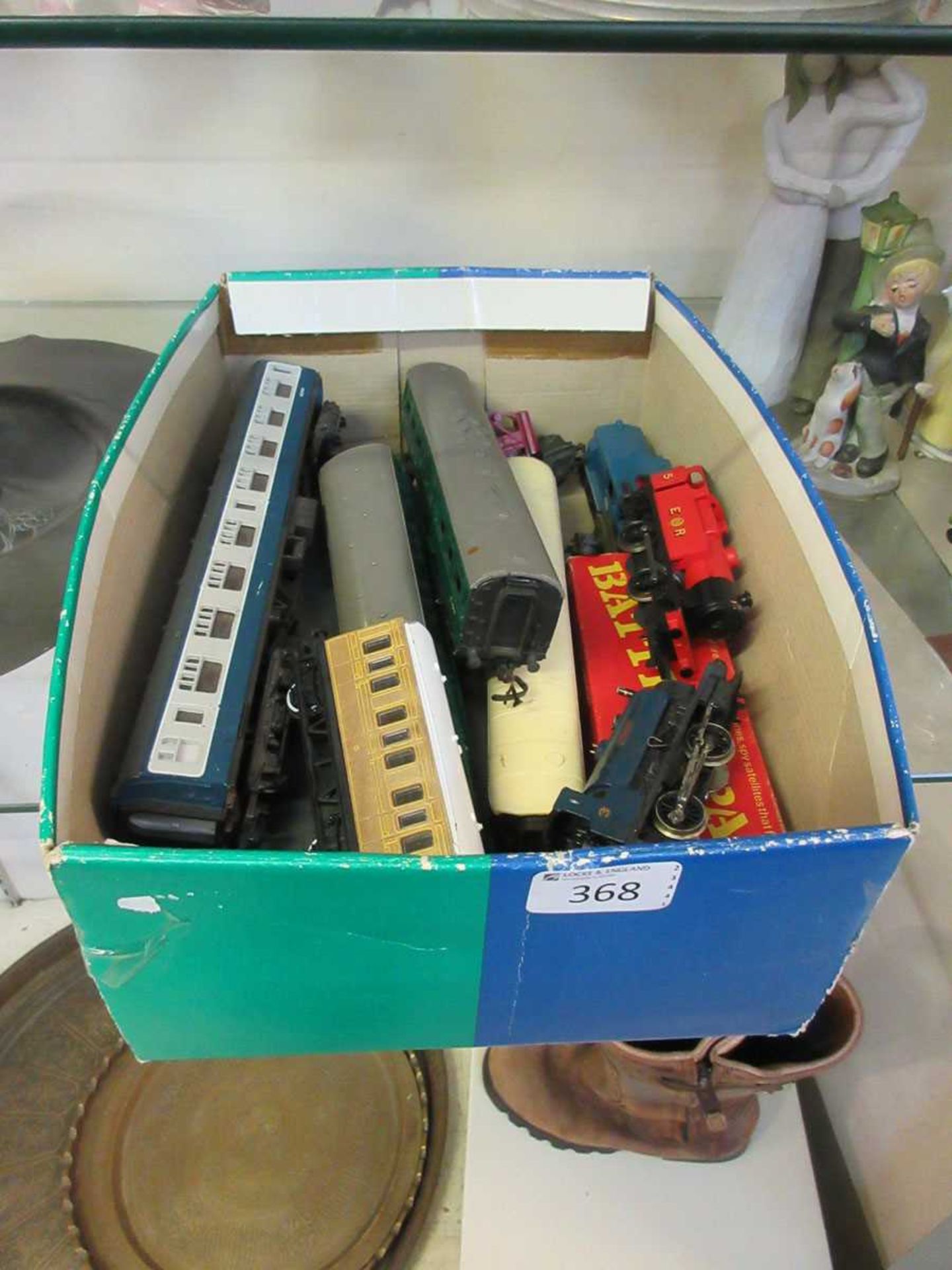 A box containing a quantity of railway carriages, engines etc