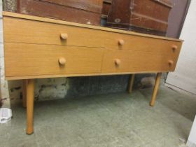 A mid-20th century chest of four drawers