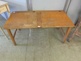 A mid-20th century twin school desk