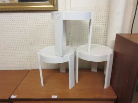 Three white PVC circular occasional tables