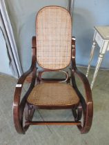 A reproduction bent wood style rocking chair