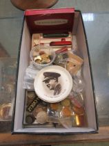 A box containing military buttons, coinage, etc