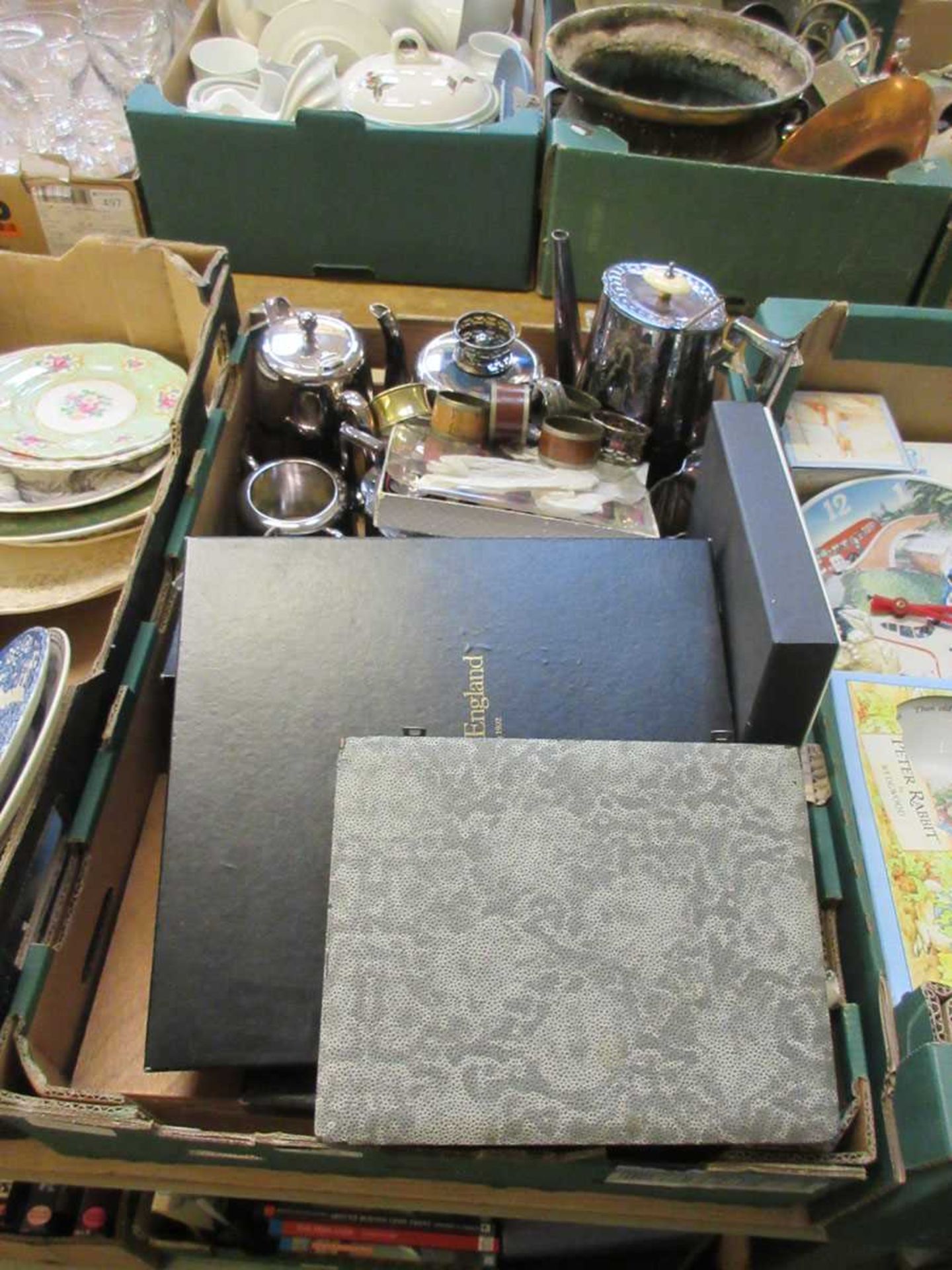 A tray containing plated ware to include coffee pots, tea set, napkin rings, flat ware etc.
