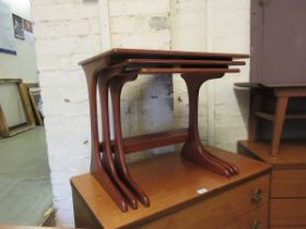 A nest of three mid-20th century occasional tables