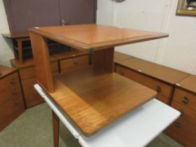 A mid-20th century design centre coffee table with under tier