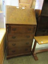 A mid-20th century walnut veneered fall fronted bureau