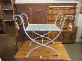 A reproduction grey painted metal stool with gilted rope design decoration