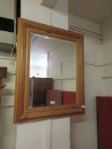 A pine framed bevel glass mirror