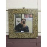 A square marble effect wall mirror