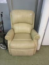 A cream leather upholstered electric reclining chair (Sold as seen)