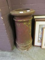 A large clay chimney pot