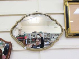 A painted framed wall mirror