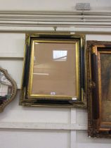 A reproduction Georgian style gilt and black painted picture frame