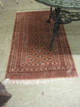An eastern brown rectangular rug