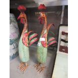 A pair of comical metalwork figures of chickens