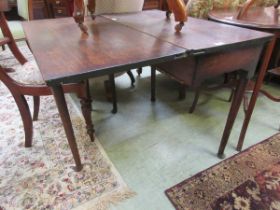 A Georgian mahogany drop leaf table on pad feet