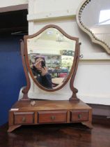 A reproduction Victorian style shield back bevel glass toilet mirror
