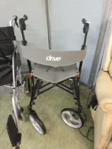 A four wheeled walking aid with seat