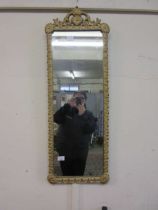 An ornate gilt framed wall mirror