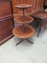 A 19th century mahogany three tier dumb waiter