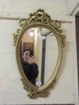 An ornate framed wall mirror