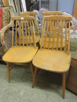 A set of four mid 20th century Scandinavian design spindle back chairs