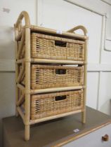 A modern bamboo and wicker three drawer chest