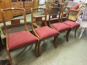 A set of four regency style dining chairs